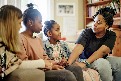Fotografie Children, counseling and education center for kids talking to a counselor or therapist before adoption in a house or home