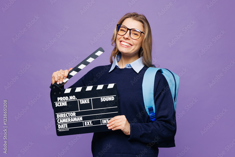 Φωτογραφία Young girl student wear blue casual clothes glasses backpack bag hold in hand classic black film making clapperboard isolated on plain pastel purple background