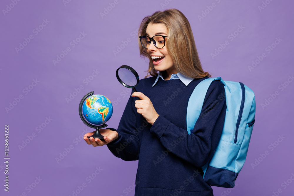 Fototapeta premium Young surprised girl student wear blue casual clothes glasses backpack bag hold in hands Earth globe map use reading-glass isolated on plain purple background. High school university college concept.