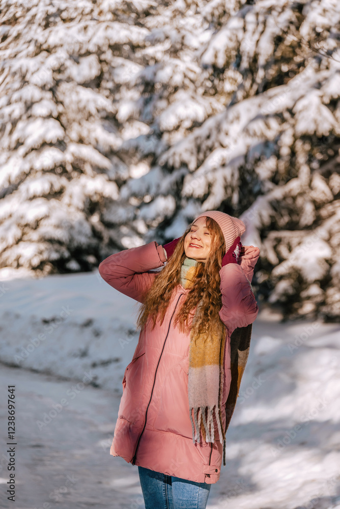 Happy Woman Enjoying Walk in Winter Forest