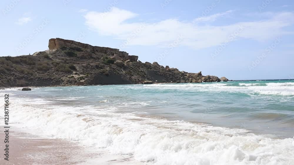 Big waves on Riviera beach in Ghajn Tuffieha Bay on Malta Big waves on Riviera beach in Ghajn Tuffieha Bay on Malta