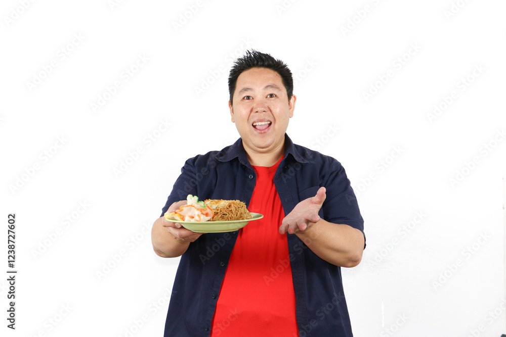 Man serve Delicious Indonesian fried rice on plate Man serve Delicious Indonesian fried rice on plate