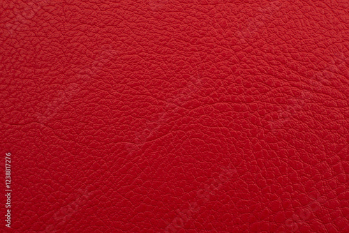 Background made of genuine red leather. Material. Texture of colored leather