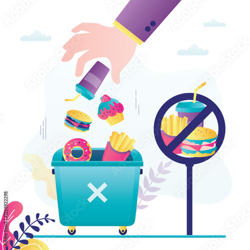 Human hand throws junk food into trash can. Concept of healthy eating and weight loss. Stop eating unhealthy food. Choosing right nutrition. Refusal of sweet and fast food