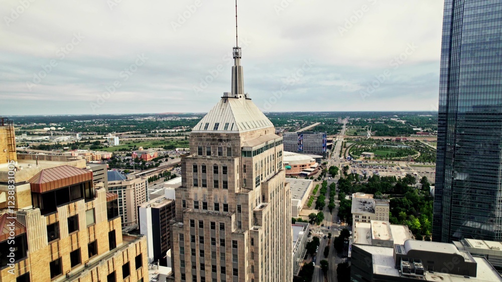 Obraz premium Skyscrapers on the outskirts of an American city. Drone view of the skyscraper spire. A sunny summer day