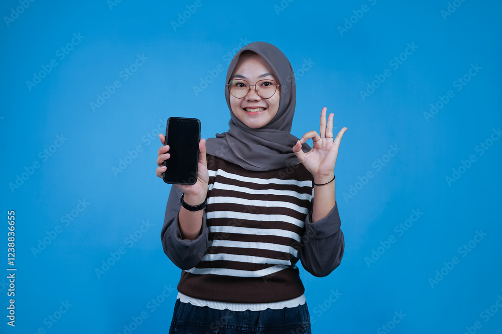 Woman Holding Smartphone and Making OK Sign Woman Holding Smartphone and Making OK Sign