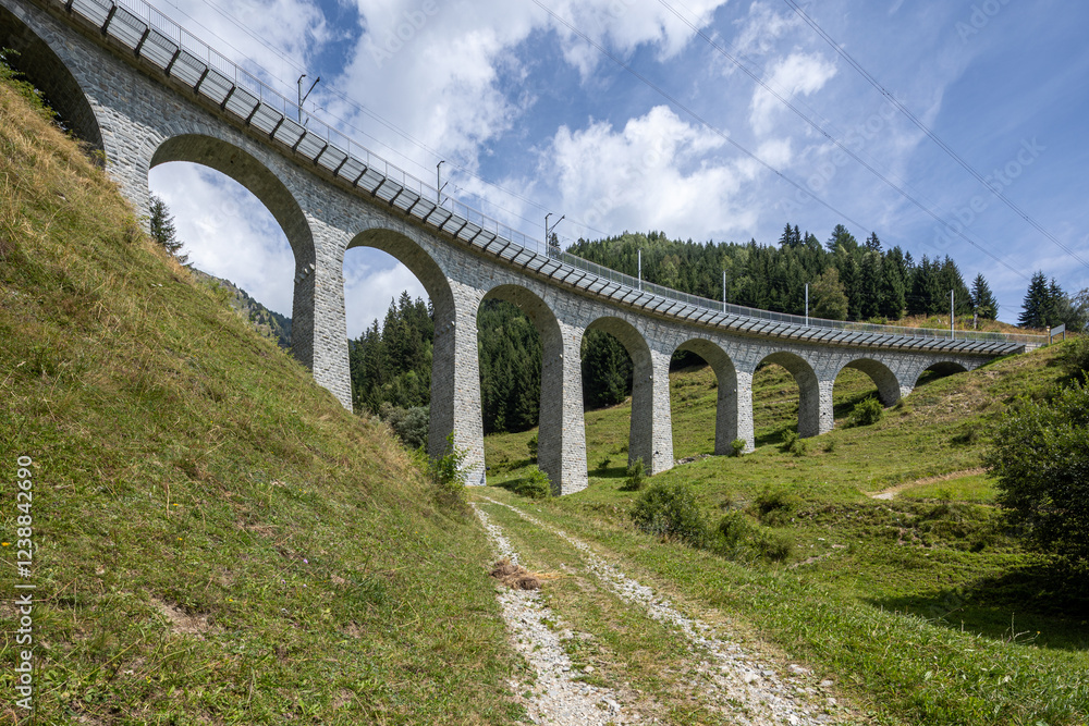 Fototapeta premium Railroad bridge in Tujetsch, so many beautiful stone bridges.