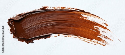 Brown paint brushstroke on white background with textured edges and copy space