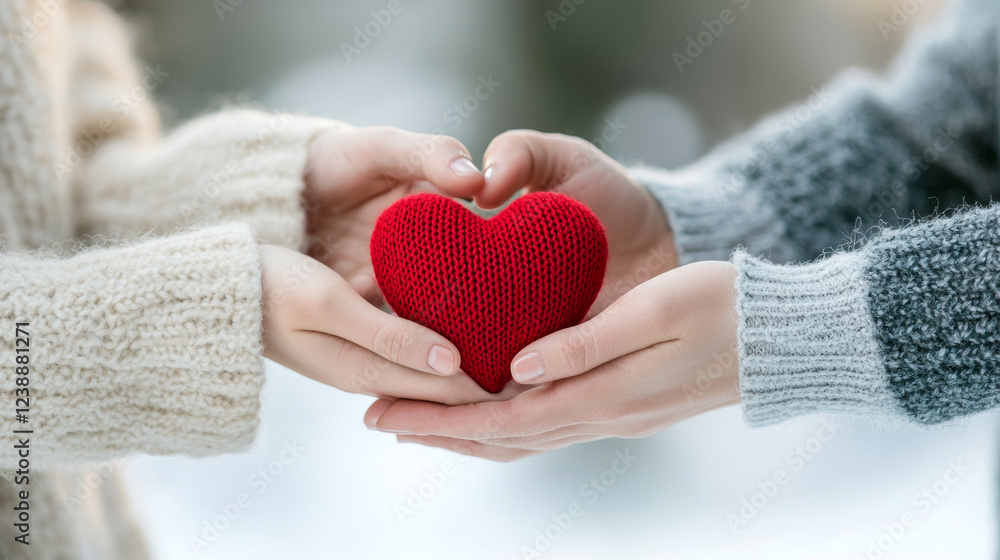 Close up of family hands holding red heart, symbolizing love and connection. warm knit textures add cozy feeling to moment Close up of family hands holding red heart, symbolizing love and connection. warm knit textures add cozy feeling to moment