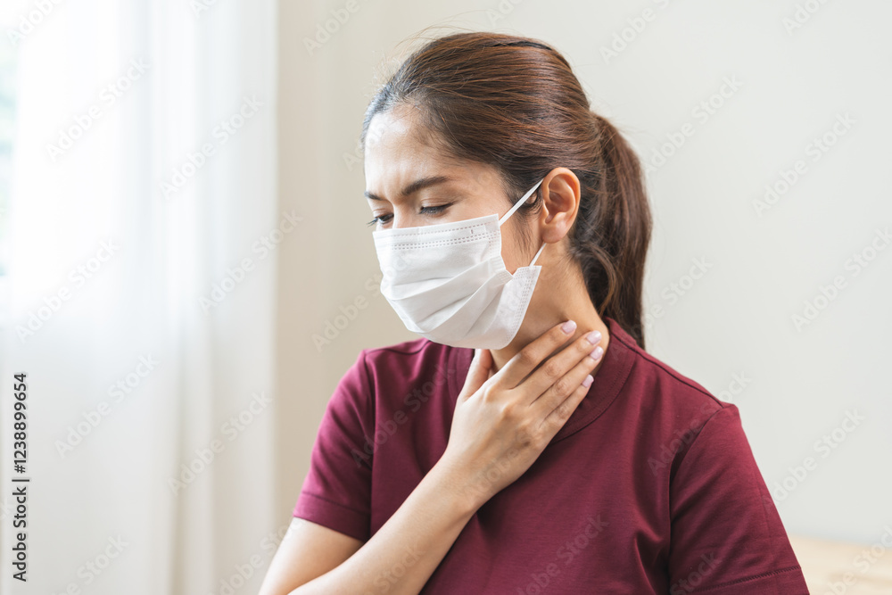 Sickness in inflaming asian young woman, girl use hand check self touch at sore throat, pain thyroid gland on neck or disease reflux, acid of suffer people on wall background. Medical and healthcare. Sickness in inflaming asian young woman, girl use hand check self touch at sore throat, pain thyroid gland on neck or disease reflux, acid of suffer people on wall background. Medical and healthcare.