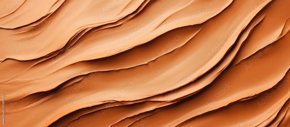 Obraz premium Abstract layers of textured orange clay with wavy pattern