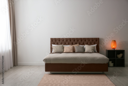 Cozy bedroom interior with mocha mousse shade. Trendy color of 2025 year