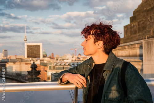 Tourist enjoying berlin cityscape at sunset 