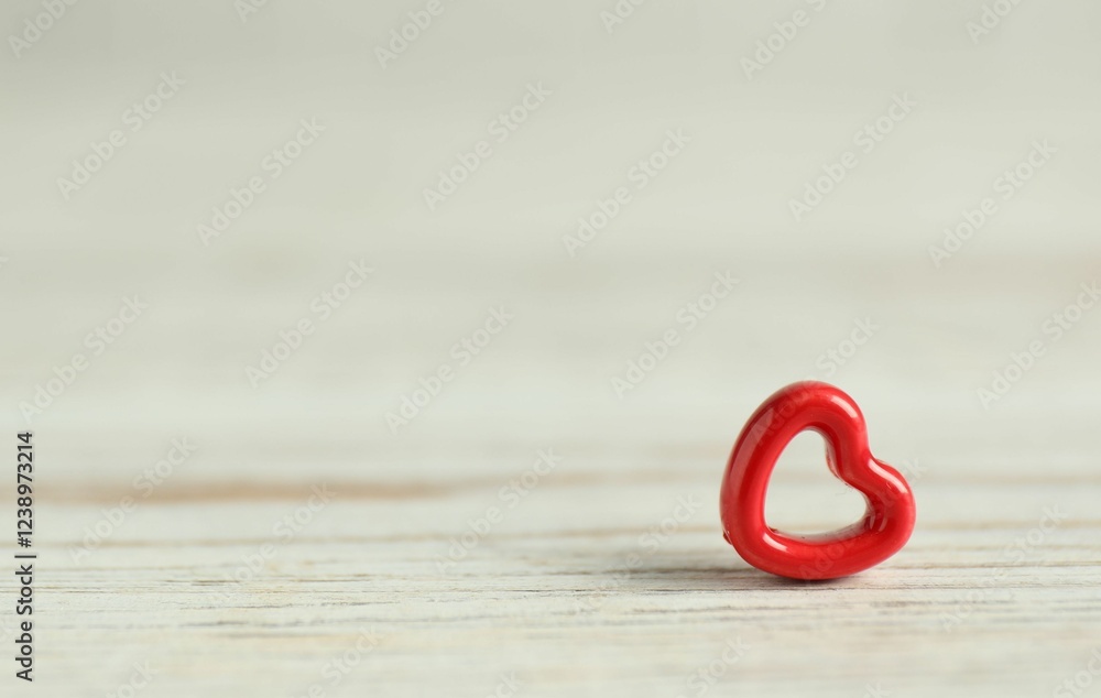 Red decorative heart on white wooden table, space for text. Happy Valentine's day Red decorative heart on white wooden table, space for text. Happy Valentine's day