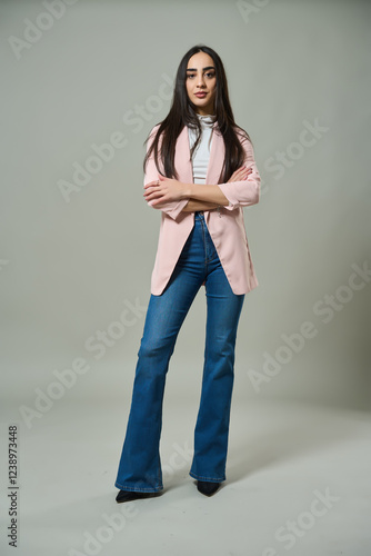 Fashionable woman posing in casual blazer outfit