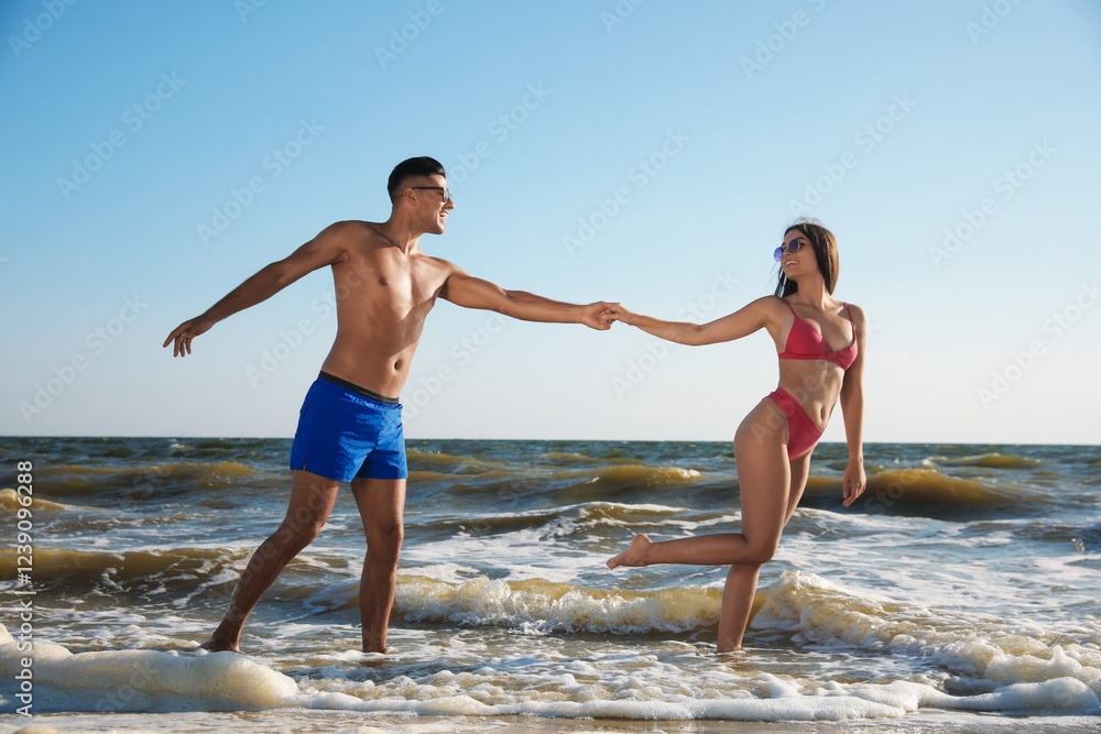 Lovely couple spending time together on beach Lovely couple spending time together on beach