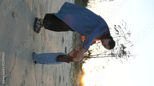 Mom is practicing for the baby and playing on the beach photo