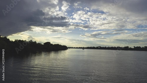 Wallpaper Mural Peaceful sunset over the Zambezi River with soft light and shadows on the tranquil water surface Torontodigital.ca