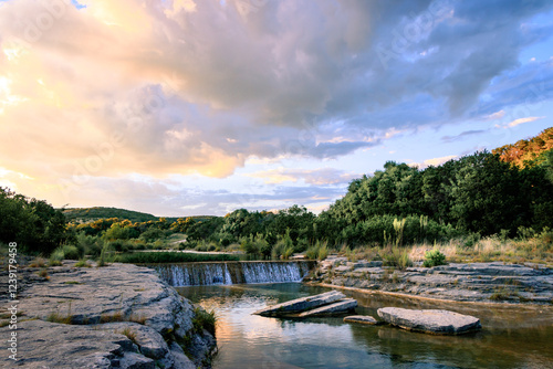 stream and waterfall at sunset 