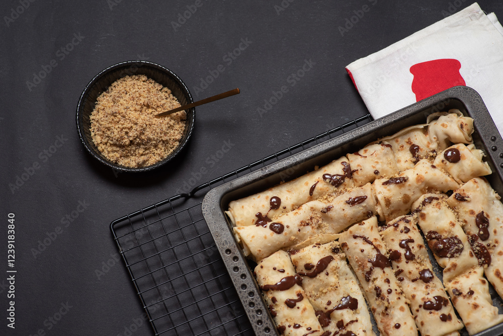 Delicious Chocolate Drizzled Crepe on Black Tray