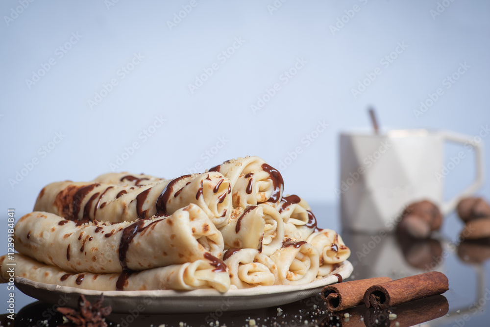 Delicious rolled crepe drizzled with chocolate