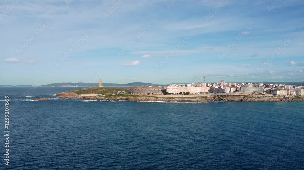Aerial view of A Coruna city. Drone slowly ascending and panning right from Hercule Tower to historic part of the city. Famous travel destination in Galicia, Spain. Aerial view of A Coruna city. Drone slowly ascending and panning right from Hercule Tower to historic part of the city. Famous travel destination in Galicia, Spain.