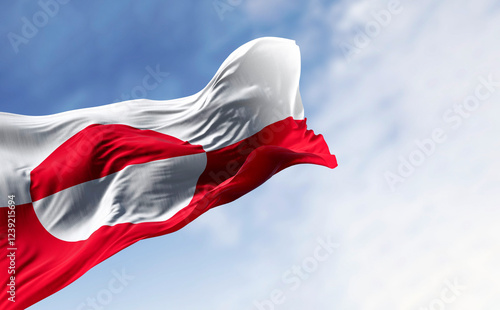 The flag of Greenland waving in the wind on a clear day. photo