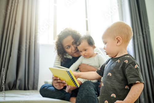 Mother, babies and learning with book in home, storytelling and education in house. Development, care and happy mama reading with children, kids or toddlers while bonding and having fun together.