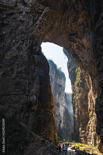 chongqing.china 24.03.2024 Tourists walking along a scenic nature trail at the breathtaking Three Natural Bridges in Wulong Karst National Geopark, Wulong City, China.