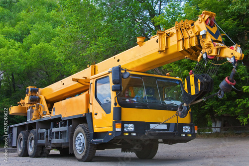 Big Power Mobile Crane on a road and tower crane in construction site