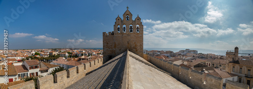 The bell tower of the Church of the Saintes Maries de la Mer , a Romanesque fortified church built in the 9th century in Saintes-Maries-de-la-Mer in Camargue photo