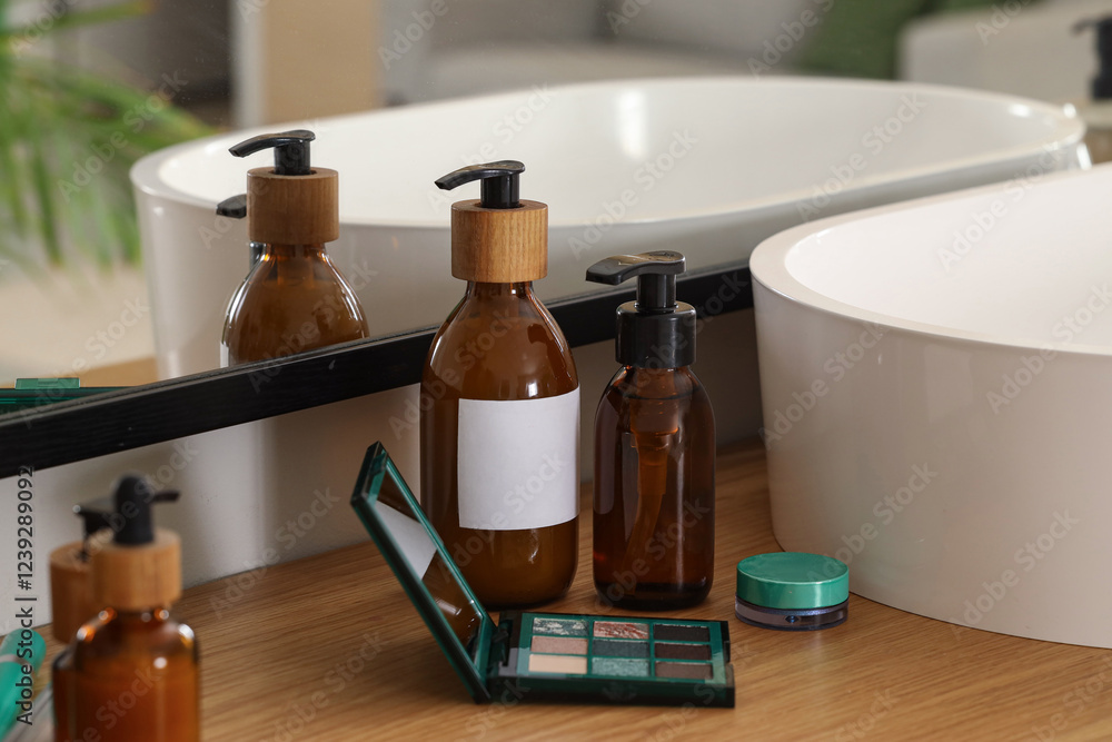 Bottles of skincare products with cosmetics on table in bathroom, closeup Bottles of skincare products with cosmetics on table in bathroom, closeup