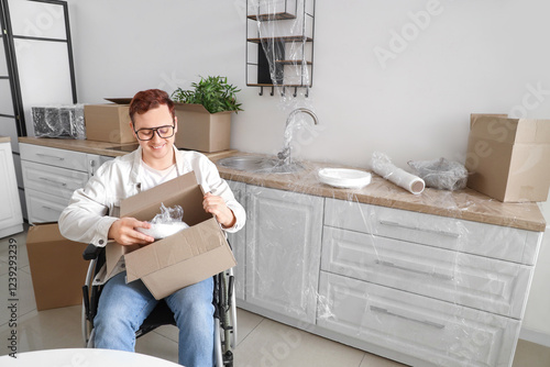 Young man in wheelchair pac...