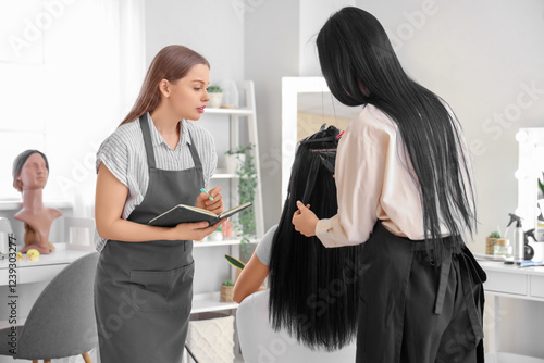 Female hairdresser with ass...