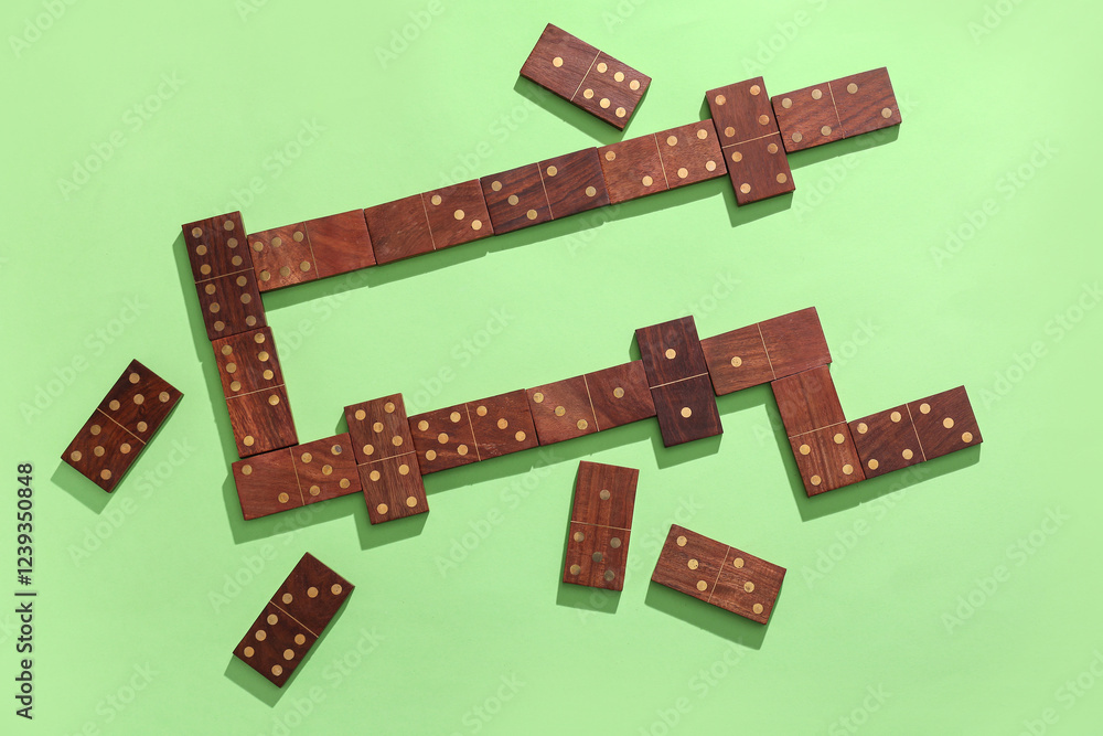 Wooden dominos blocks on green background Wooden dominos blocks on green background