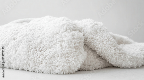Cozy comfort: close up of fluffy pillow and soft blanket for home decor