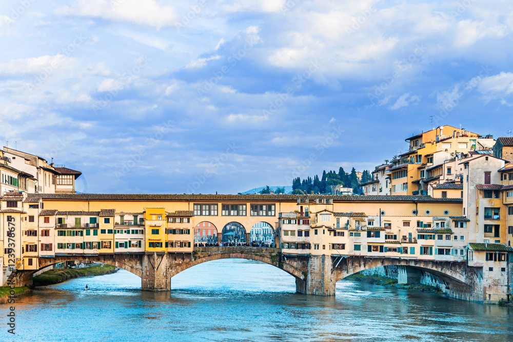 The Ponte Vecchio, Old Bridge, a Medieval stone closed-spandrel segmental arch bridge over the Arno River, with shops built along it; as jewelers, art dealers, souvenir sellers. Florence, Italy, 2019 The Ponte Vecchio, Old Bridge, a Medieval stone closed-spandrel segmental arch bridge over the Arno River, with shops built along it; as jewelers, art dealers, souvenir sellers. Florence, Italy, 2019