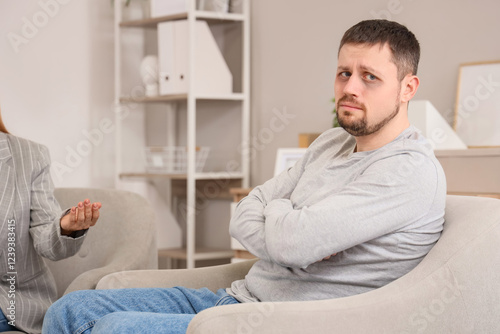 Sad male drug addict sittin...