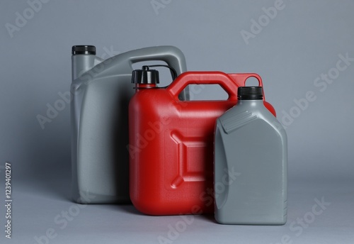 Many different plastic canisters on light grey background photo