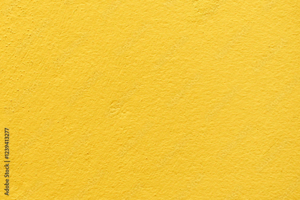 Yellow paint concrete wall. Uneven render grunge and rough surface. Yellow paint concrete wall. Uneven render grunge and rough surface.