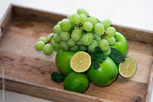 Fruit in a wooden box on a white background