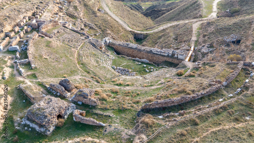 Aerial View of the Ancient Ruins of Augusta Bilbilis in northern Spain on Grassy Hillside photo