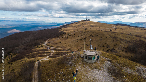 A breathtaking aerial drone view of Slavnik, one of Slovenia's most iconic peaks, standing at 1,028 meters above sea level. Located in the Karst region near the border with Croatia photo