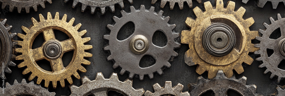 Intricate arrangement of gears in various colors and sizes Intricate arrangement of gears in various colors and sizes
