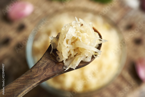 Homemade fermented cabbage or sauerkraut on a spoon