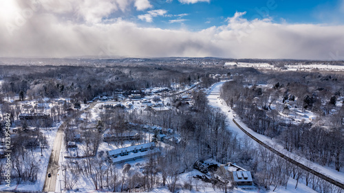 Perinton, NY, USA - 02-01-2025: Winter afternoon aerial photo of the Town of Perinton, near the Hamlet of Bushnell's Basin with snow on the ground.	 photo