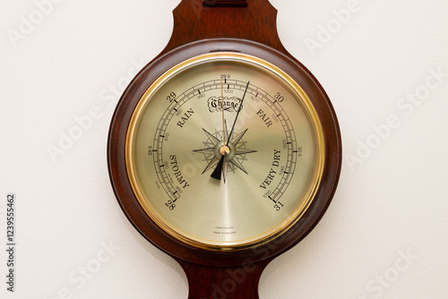 Close up of the face of an aneroid barometer