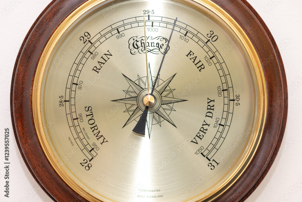 Close up of the face of an aneroid barometer Close up of the face of an aneroid barometer