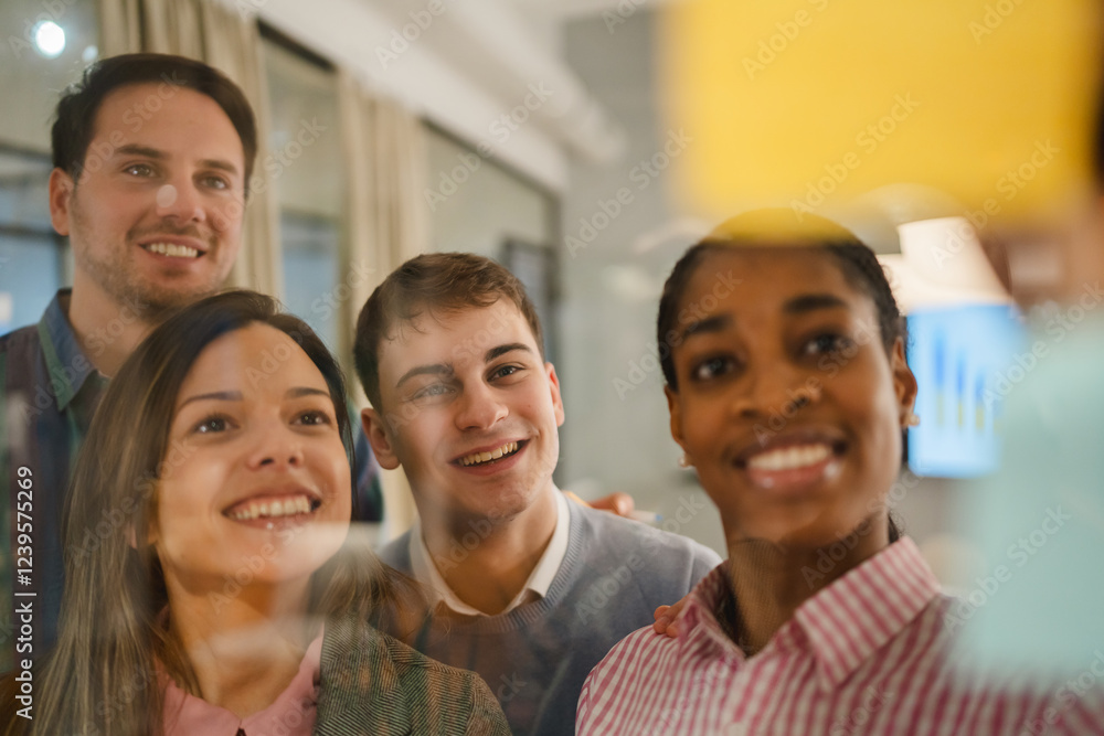 Diverse group of businesspeople brainstorming with sticky notes