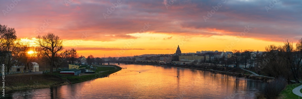 Naklejka premium Gorzow Wielkopolski skyline view of St. Mary's church tower and Warta river at sunset. Poland